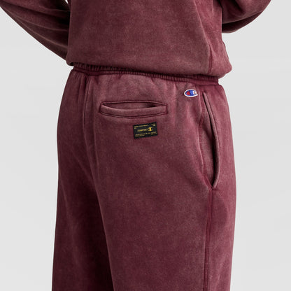 Maroon Champion Mineral Wash Open Hem Pant featuring a back pocket, a logo patch, and a small embroidered logo on the hip.