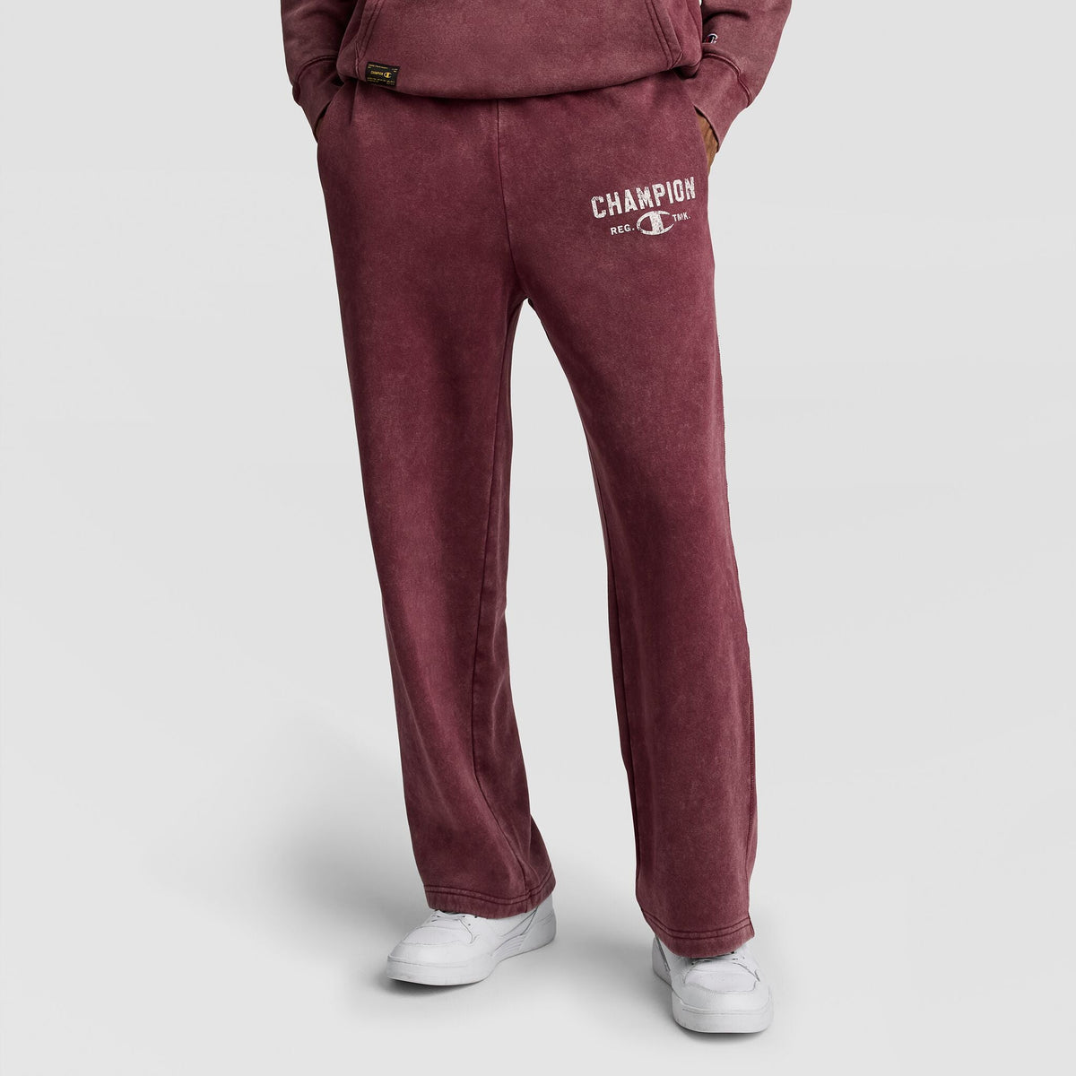 Champion Mineral Wash Open Hem Pant in deep red with a vintage look, wide hem, and a white logo on the left thigh.
