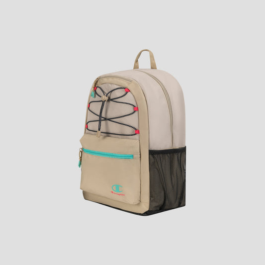 The Champion Kid’s Bungee Backpack features a stylish beige and tan design with turquoise accents, black bungee cords, a front zipper pocket, black mesh side pocket, red details, and a beige top handle. Perfect for youth sports, this durable backpack is displayed against a plain light background.