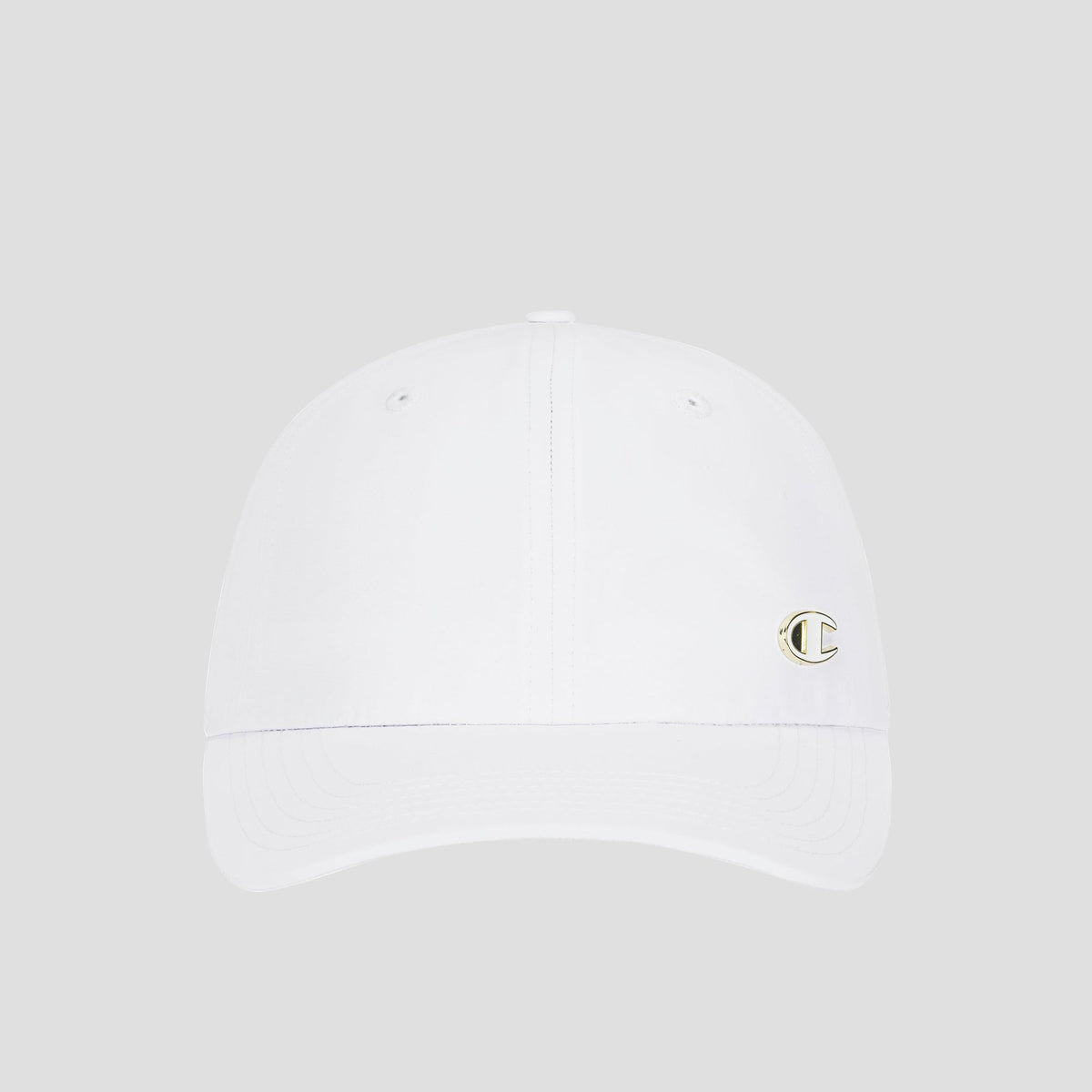 The Champion Lifestyle Sport Adjustable Cap is a white women’s performance hat featuring a small, gold-outlined C logo on the front left side. Displayed against a plain light gray background, this stylish and comfortable cap is perfect for any athletic activity.