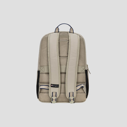The Champion Level Backpack in beige is displayed from the back against a plain light gray background, showcasing its padded shoulder straps, mesh padding for enhanced comfort, a small Champion logo at the bottom, a handy top handle, and a padded laptop sleeve—making it ideal for everyday use.