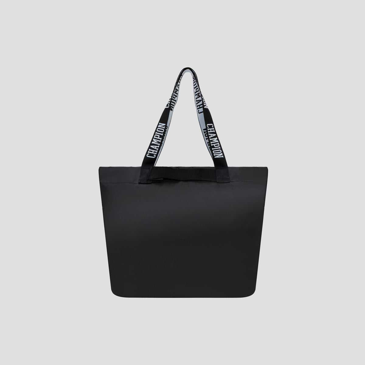 The Miller Coated Shopper Tote by Champion is a spacious black tote bag with two handles, featuring the word “CHAMPION” repeated in white across a black background. Set against a plain light gray backdrop, this stylish bag offers ample room for your essentials while ensuring you stay fashionable on the go.