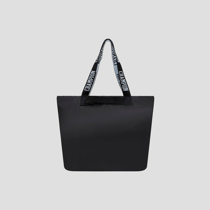 The Miller Coated Shopper Tote by Champion is a spacious black tote bag with two handles, featuring the word “CHAMPION” repeated in white across a black background. Set against a plain light gray backdrop, this stylish bag offers ample room for your essentials while ensuring you stay fashionable on the go.