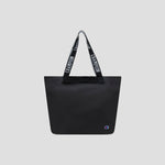 Miller Coated Shopper Tote by Champion in black, featuring “CHAMPION” text on the handles and a small Champion logo at the bottom right corner, displayed on a plain light gray background. This spacious shopper tote includes organizational pockets, making it ideal for keeping your essentials neatly arranged.