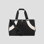 Black and white Oracle Duffel Bag by Champion with top handles and a detachable shoulder strap, displayed against a plain gray background. This versatile gym bag features a small Champion logo on the front.