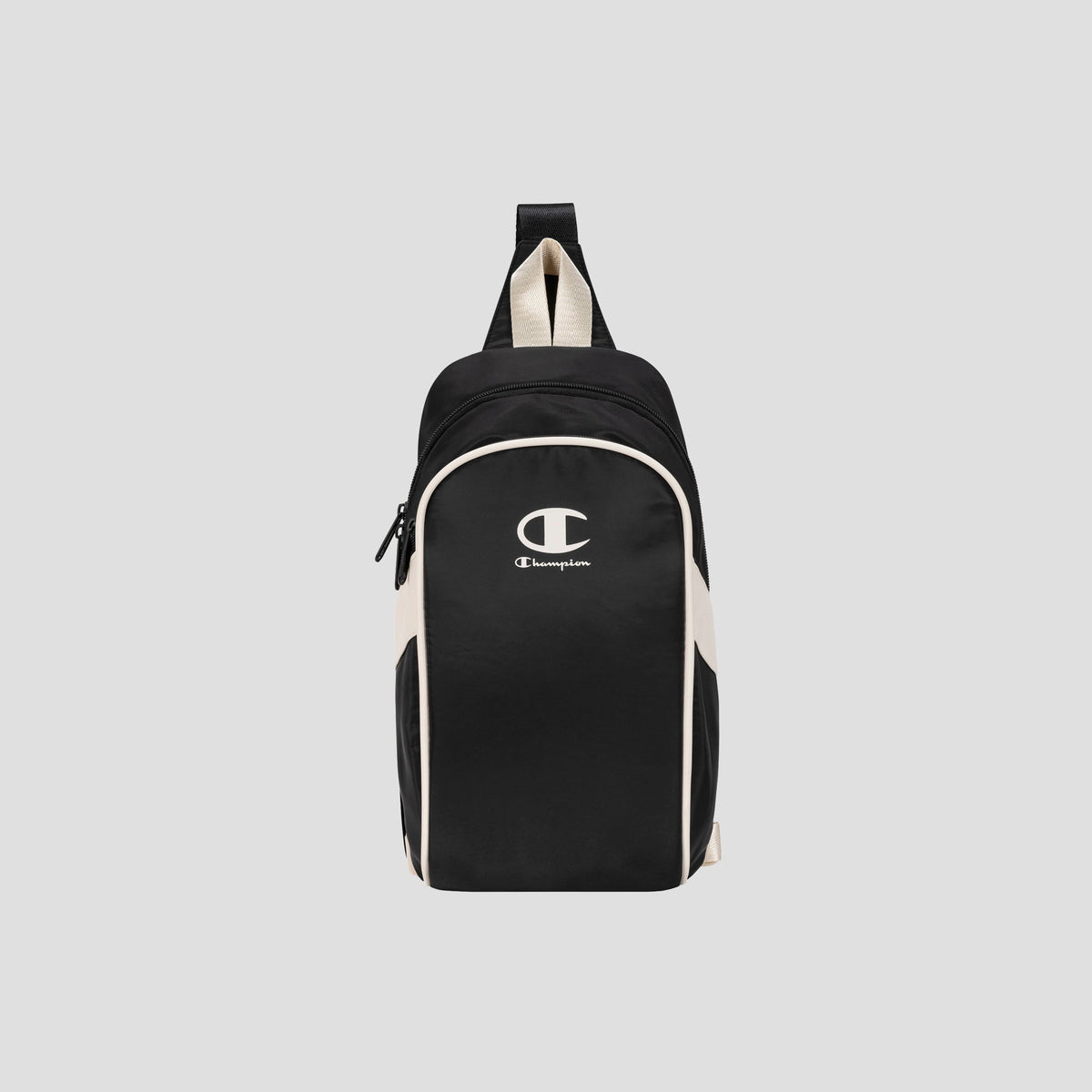 The Champion Oracle Sling Pack, shown in black and white against a plain light gray background, is perfect for use as a gym bag and features a front zipper pocket, white Champion logo on the front, and a top handle.