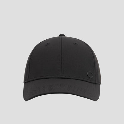 A sleek black Ponytail Baseball Cap by Champion, featuring minimal stitching and a small embossed logo on the front left side. Made from performance stretch fabric, this stylish cap delivers both comfort and flexibility. Set against a light gray background.