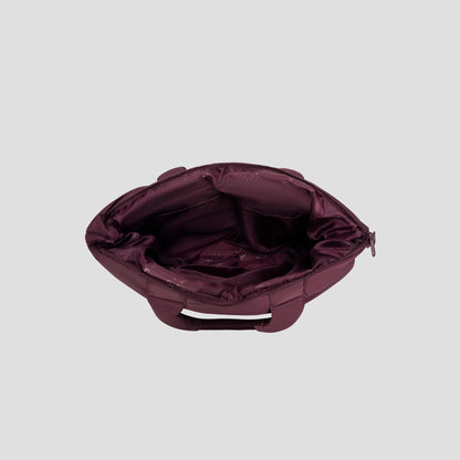A top-down view of the Champion Quilted Billie Tote in open maroon, featuring a chic quilted design, multiple inner pockets, and a secure zipper closure. The empty interior is displayed against a light gray background—making it an ideal choice for everyday use.