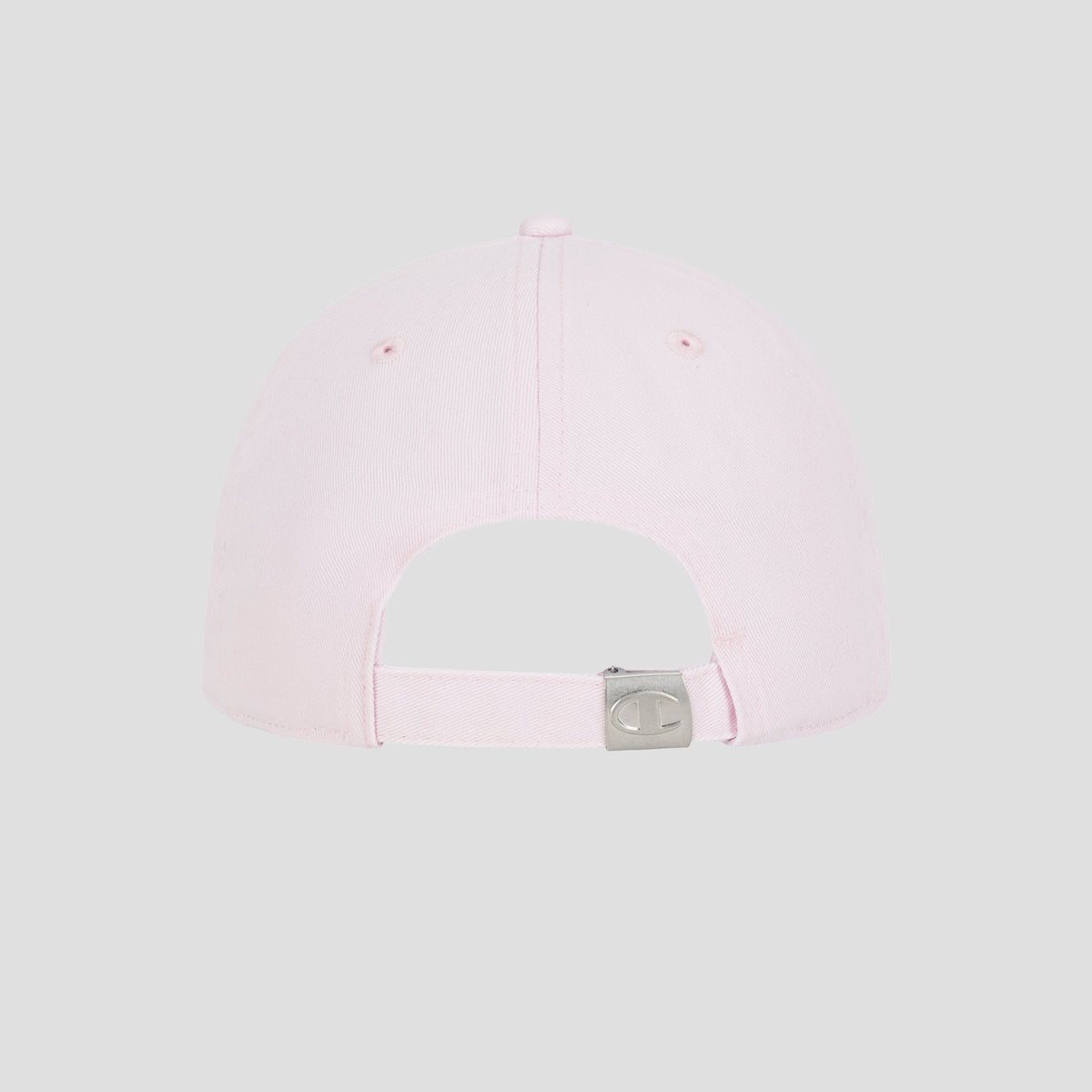 A light pink Script Embroidery Adjustable Cap by Champion is shown from the back, featuring an adjustable strap with a metal buckle. The cap has a plain design with no visible logos or embellishments, set against a light gray background.