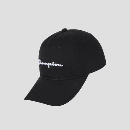 The Script Embroidery Adjustable Cap by Champion is crafted from washed black cotton twill and features white “Champion” script embroidery on the front, displayed against a light gray background.