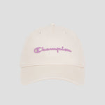 The Champion Script Embroidery Adjustable Cap is made from premium washed beige cotton twill and showcases “Champion” embroidered in purple cursive on the front, set against a simple light gray background.