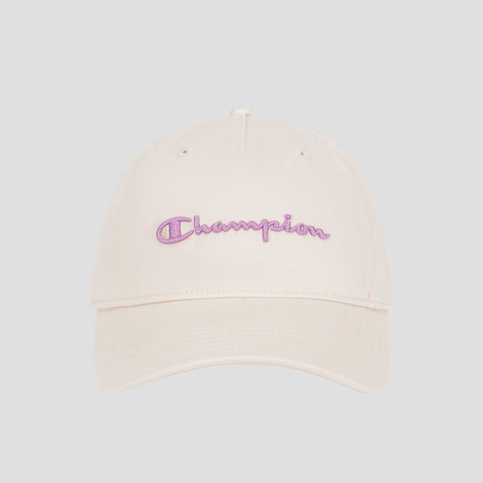 The Champion Script Embroidery Adjustable Cap is made from premium washed beige cotton twill and showcases “Champion” embroidered in purple cursive on the front, set against a simple light gray background.