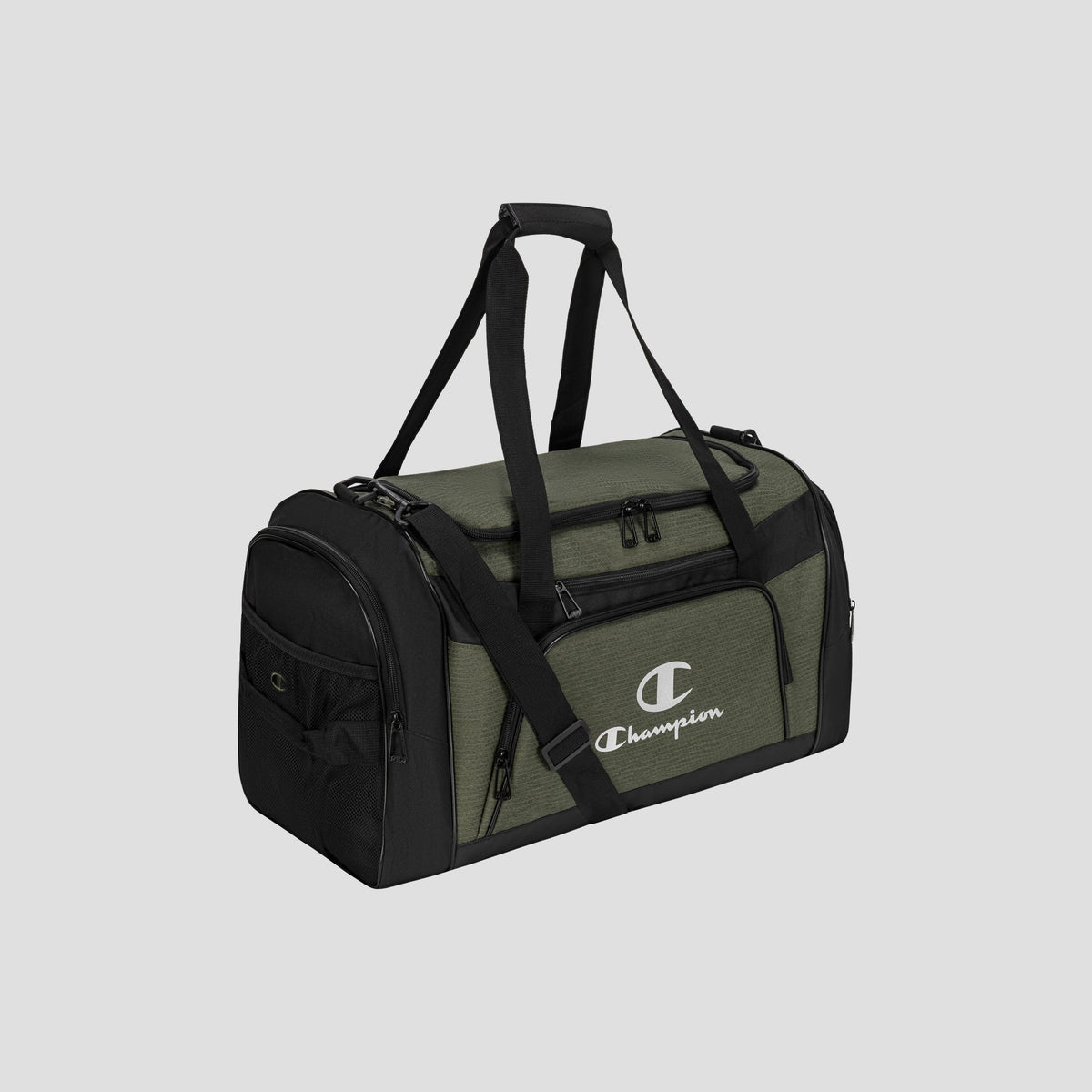 The Champion Stadium Duffel Bag is shown in green and black on a plain gray background. It features multiple zippered compartments, a side pocket, two handles, and a shoulder strap.