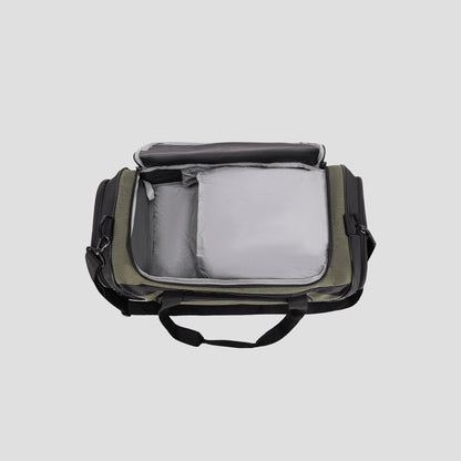 A Champion Stadium Duffel Bag in olive green and black, featuring gray padded interior compartments, is displayed on a light gray background.