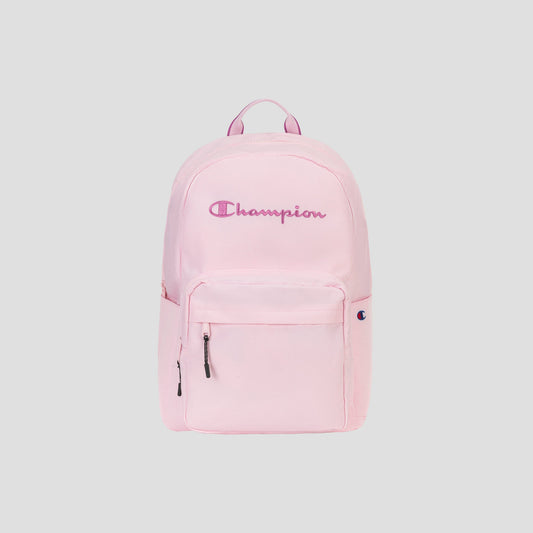 A light pink Steady Backpack by Champion featuring a front pocket, zipper closures, a padded laptop sleeve, and the Champion logo embroidered in pink and purple on the front.