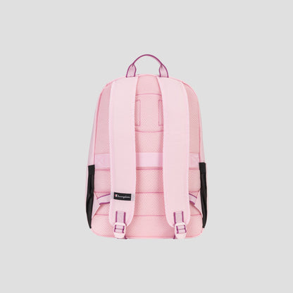 The Champion Steady Backpack in light pink features padded shoulder straps, a padded laptop sleeve, mesh side pockets, a top carrying handle, and a small black tag, displayed against a plain gray background.