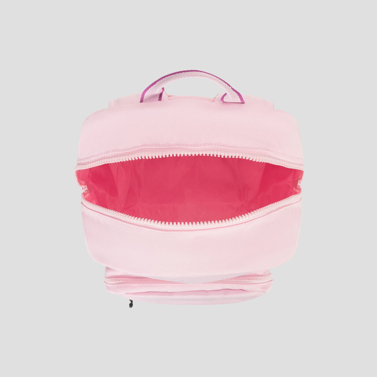 A light pink Champion Steady Backpack with a zippered main compartment, partially open to reveal a bright pink interior and a padded laptop sleeve. The bag features a matching pink handle on top and is set against a plain gray background.