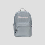 Introducing the Steady Backpack from Champion: this light gray bag features a front zip pocket, dual zipper pulls, and the Champion logo in white and pink displayed across the upper front. Designed with a fabric top handle and a streamlined, minimalist look, it’s perfect for carrying all your essentials in style.