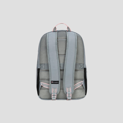 The Champion Steady Backpack in gray, featuring padded shoulder straps and pink accents, is displayed from the back against a plain light gray background. The design includes mesh padding and a small black Champion logo near the bottom.
