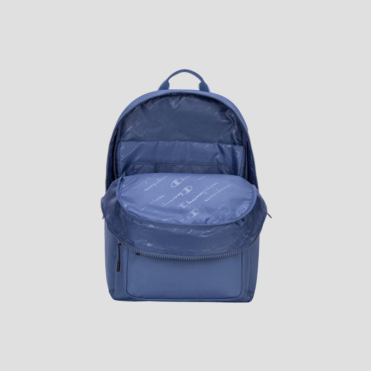 A blue Champion Steady Backpack with its main compartment unzipped, revealing a spacious interior ideal for a 17″ laptop and a small front zip pocket, displayed against a plain light gray background.