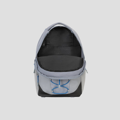 The Champion Summit Backpack is displayed in grey and black with its main compartment open, revealing a spacious, empty interior. This premium backpack features blue stitching, a padded laptop sleeve for added protection, weather-resistant material, and a front pocket with a unique blue design.