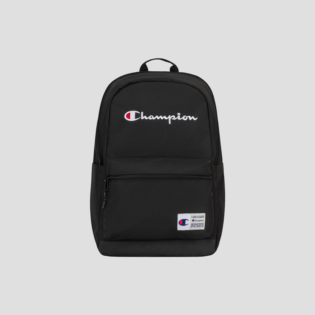 A black Champion System Backpack with the Champion logo embroidered in white and red on the front, featuring multiple storage compartments for organization, a front zip pocket, and a small white patch label on the lower right side. The background is light gray.