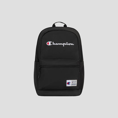 A black Champion System Backpack with the Champion logo embroidered in white and red on the front, featuring multiple storage compartments for organization, a front zip pocket, and a small white patch label on the lower right side. The background is light gray.