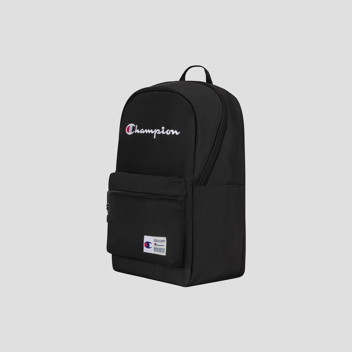 A black Champion System Backpack featuring multiple storage compartments—including a padded laptop sleeve, a front zip pocket, distinctive white Champion logo text on the upper pocket, and a small Champion patch on the lower pocket—displayed against a plain light gray background.