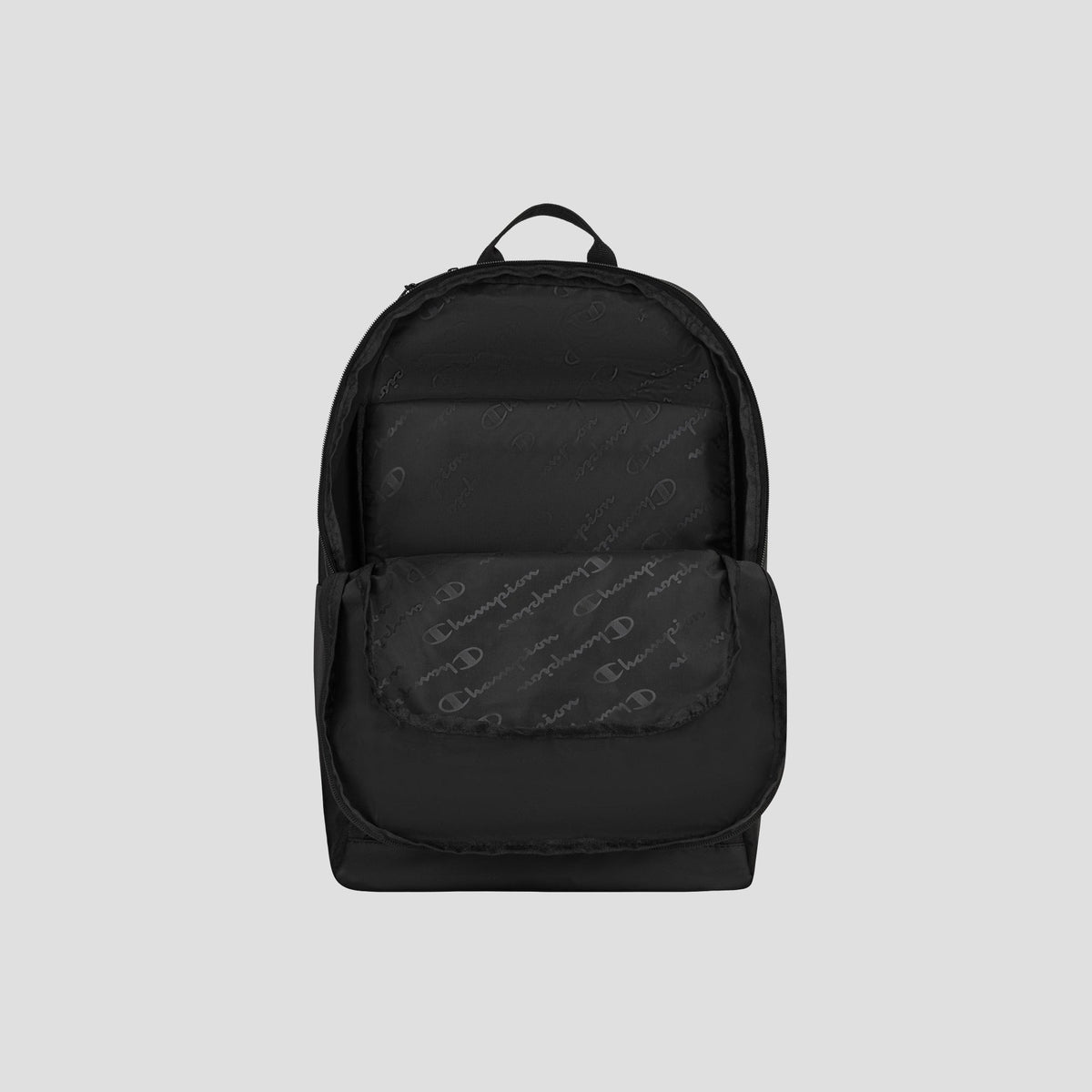 The Champion System Backpack, featuring a subtle logo pattern, front pocket, padded laptop sleeve, and top handle, is showcased against a plain light gray background.