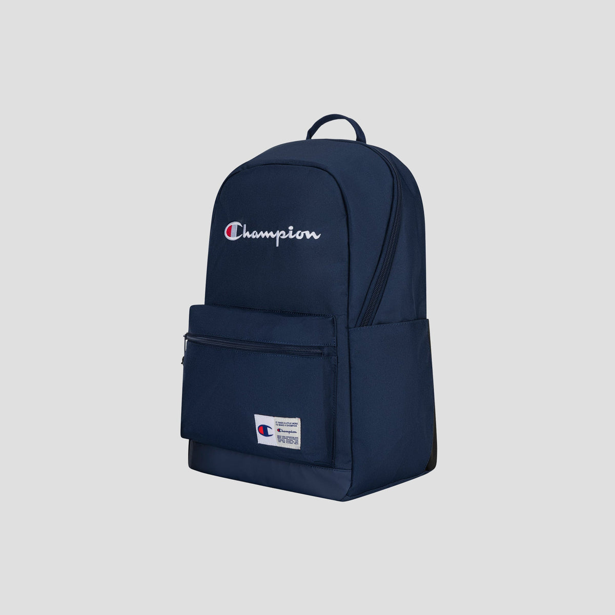Introducing the Champion System Backpack in navy blue, featuring a spacious main compartment with multiple storage sections for ultimate convenience. The front zipper pocket is accented by a small white Champion logo patch, while a larger embroidered Champion logo stands out on the upper front of the bag. Designed for both style and practicality, this backpack includes a padded laptop sleeve to securely store your device. Displayed against a plain grey background, the System Backpack combines signature