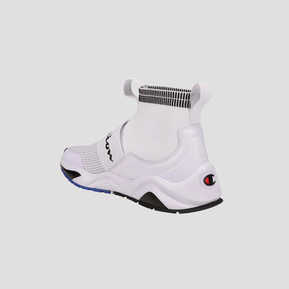 The Champion Kids' Rally Pro features a white knit slip-on design with a high sock-like collar, black and blue sole accents, and the Champion logo on the heel—shown from the back against a plain light background.