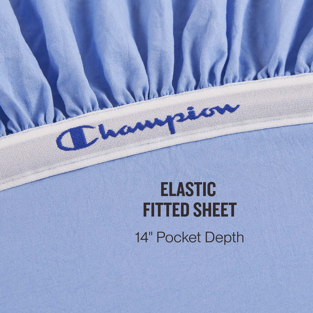 Close-up of the Champion Elastic Logo Microfiber Sheet Set in light blue, featuring an elastic band with embroidered Champion logo detail. Text reads: ELASTIC FITTED SHEET 14″ Pocket Depth.