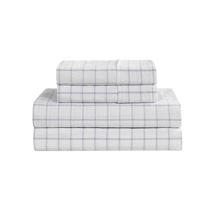 A neatly arranged stack of Champion Printed Microfiber Sheet Sets in white with a light blue grid pattern rests against a plain white background—these wrinkle-resistant sheets blend style and practicality to refresh your bedroom.