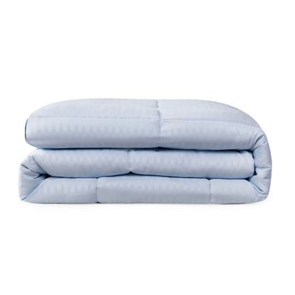 The Champion Blue Cooling Down Alternative Comforter is neatly folded and displayed against a plain white background.
