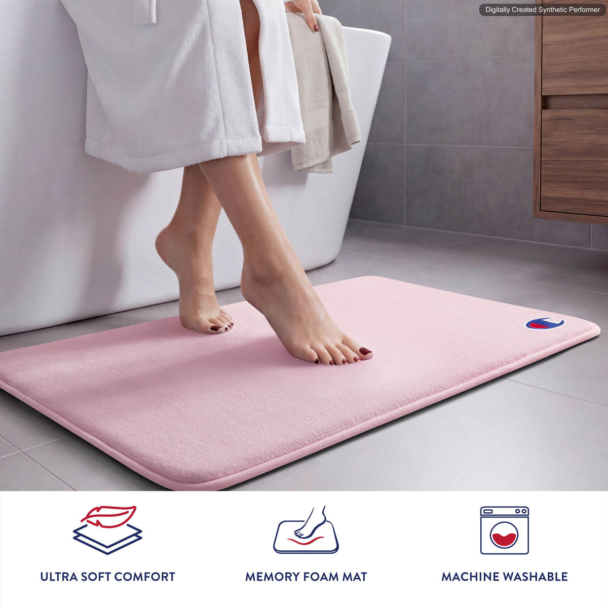 A person steps out of a bathtub onto a pink Champion Logo Patch Memory Foam Bath Mat. This skid-resistant mat showcases the Champion embroidered logo patch in one corner. Icons below highlight its ultra-soft comfort, memory foam cushioning, and machine washable convenience.