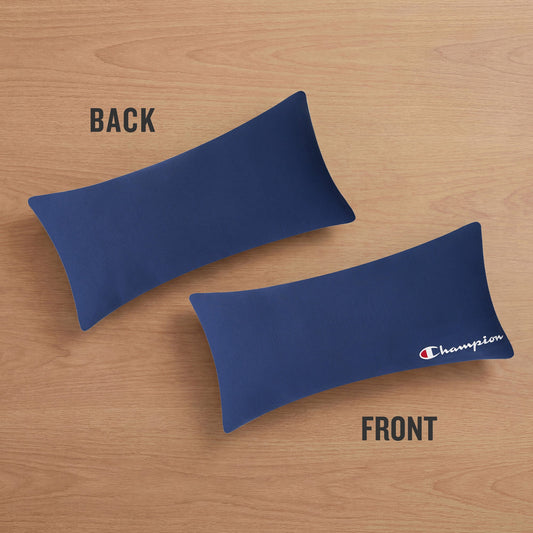 Two navy blue rectangular Jersey Body Pillows by Champion rest on a wooden surface. The FRONT pillow showcases the iconic Champion logo for an athletic accent, while the BACK pillow is plain with no logo. Crafted from soft jersey knit fabric, these Champion pillows bring sporty style and comfort to any space.
