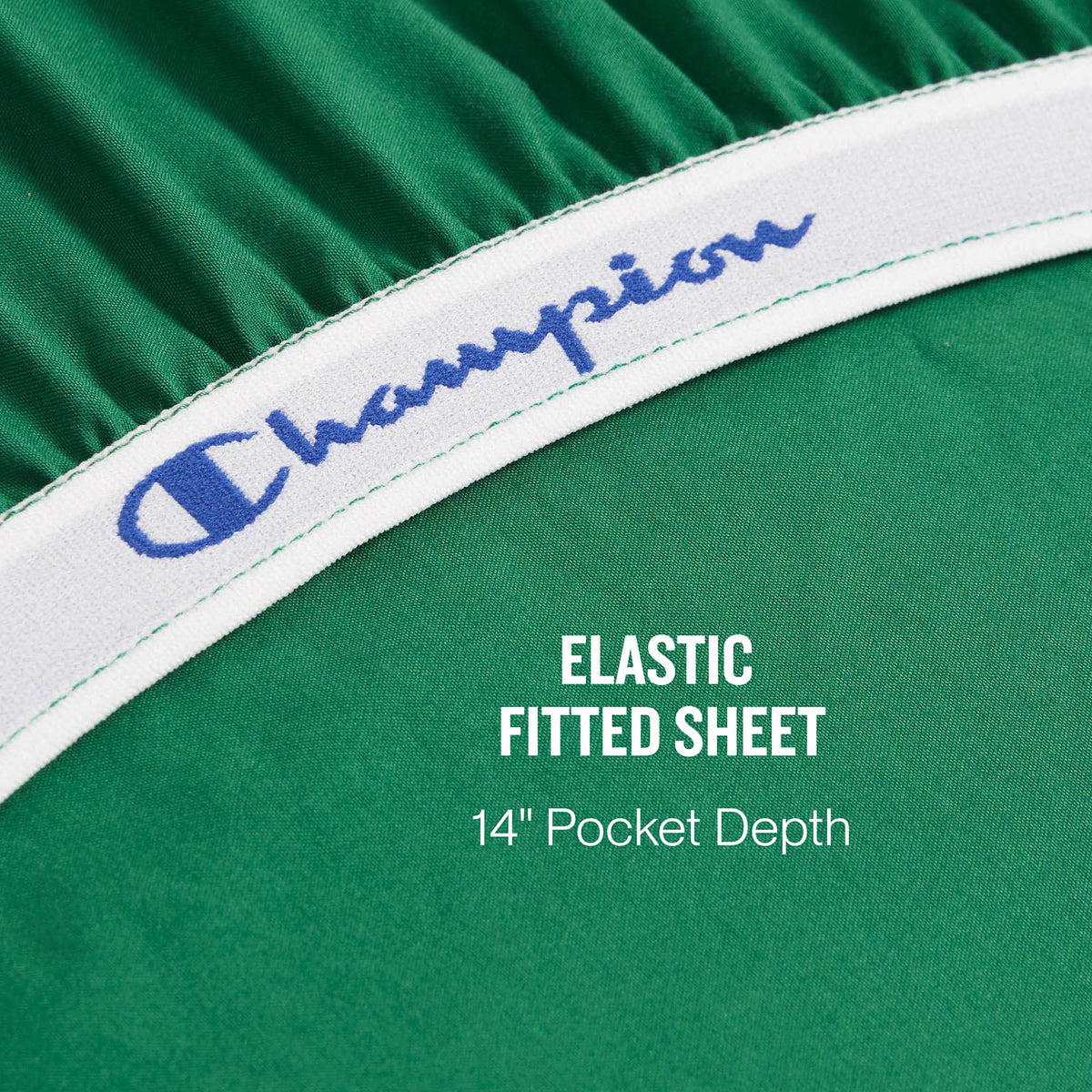 Close-up of a green elastic fitted sheet from the Champion Elastic Logo Microfiber Sheet Set, featuring “Champion” in blue on the white elastic band. Text on the sheet reads: ELASTIC FITTED SHEET 14 Pocket Depth.